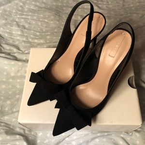 Black suede bow tie slingback pumps